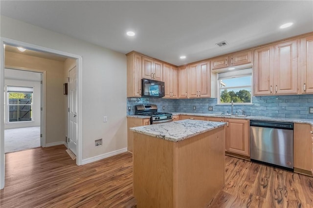 8 Central Heights Way, Bentonville, AR 72712 - kitchen featuring appliances with stainless steel finishes, light brown cabinetry, wood finished floors, light stone counters, and recessed lighting