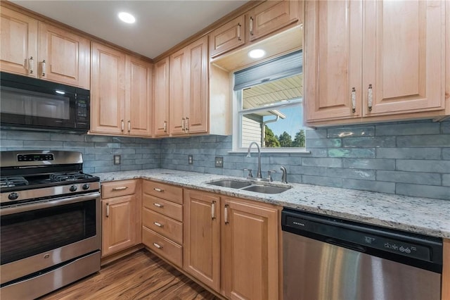 8 Central Heights Way, Bentonville, AR 72712 - kitchen featuring stainless steel appliances, a sink, tasteful backsplash, light stone counters, and dark wood-style flooring