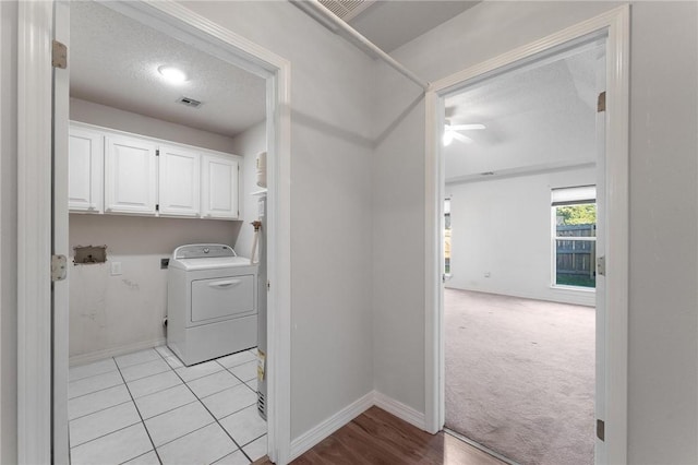 8 Central Heights Way, Bentonville, AR 72712 - laundry area with washer / dryer, cabinet space, ceiling fan, baseboards, and a textured ceiling