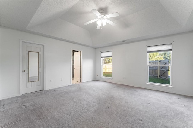 8 Central Heights Way, Bentonville, AR 72712 - unfurnished bedroom with carpet floors, a tray ceiling, ensuite bathroom, ceiling fan, and vaulted ceiling