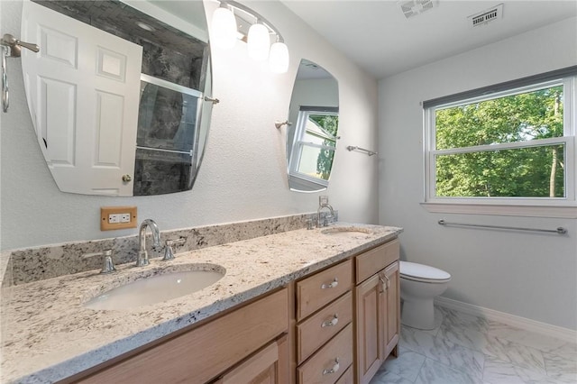 8 Central Heights Way, Bentonville, AR 72712 - bathroom featuring double vanity, marble finish flooring, a shower with shower door, toilet, and baseboards