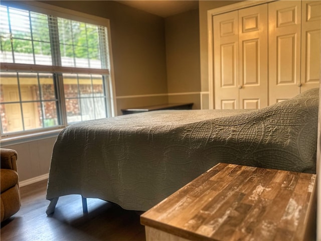 3002 W 4th St, Russellville, AR 72801 - bedroom featuring wood finished floors, a closet, and baseboards