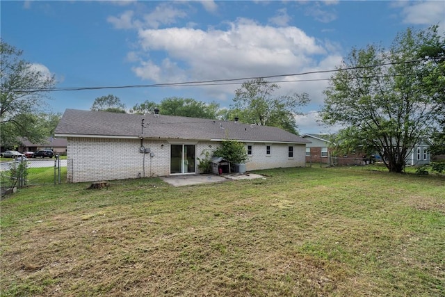 1205 Jo Lynn St, Siloam Springs, AR 72761 - back of property featuring a patio and brick siding