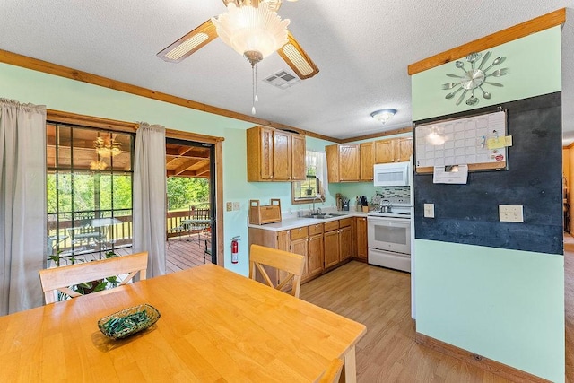 1188 Kyle Rd, Noel, MO 64854 - kitchen with white appliances, a sink, light wood-style flooring, a ceiling fan, and a textured ceiling