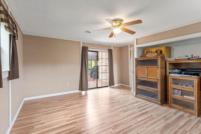 1188 Kyle Rd, Noel, MO 64854 - unfurnished living room with ceiling fan, light wood-style flooring, baseboards, and crown molding