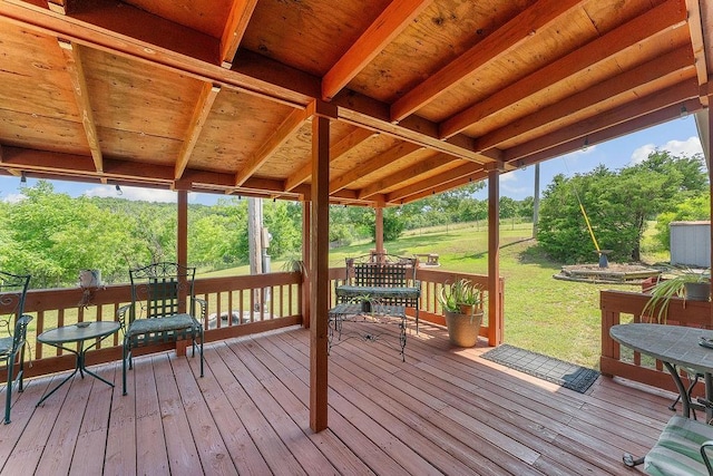 1188 Kyle Rd, Noel, MO 64854 - wooden terrace with outdoor dining area, a lawn, and view of wooded area