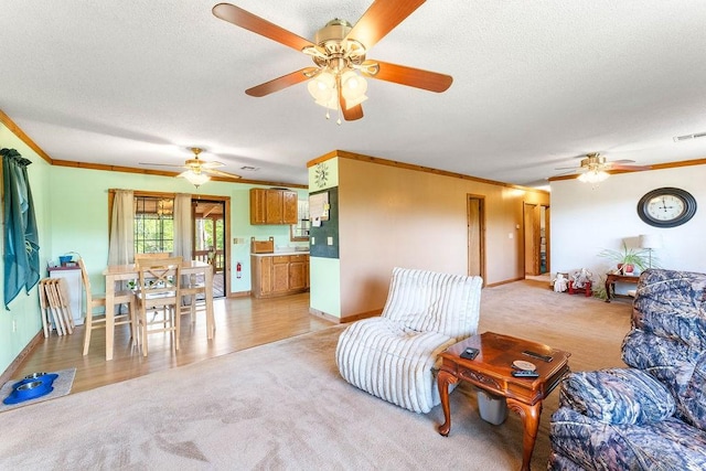 1188 Kyle Rd, Noel, MO 64854 - living room with light colored carpet, a ceiling fan, crown molding, a textured ceiling, and baseboards