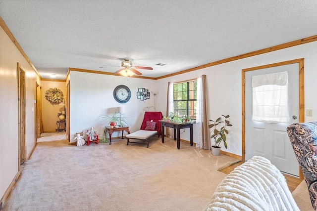 1188 Kyle Rd, Noel, MO 64854 - living area with ornamental molding, a textured ceiling, a ceiling fan, light carpet, and baseboards