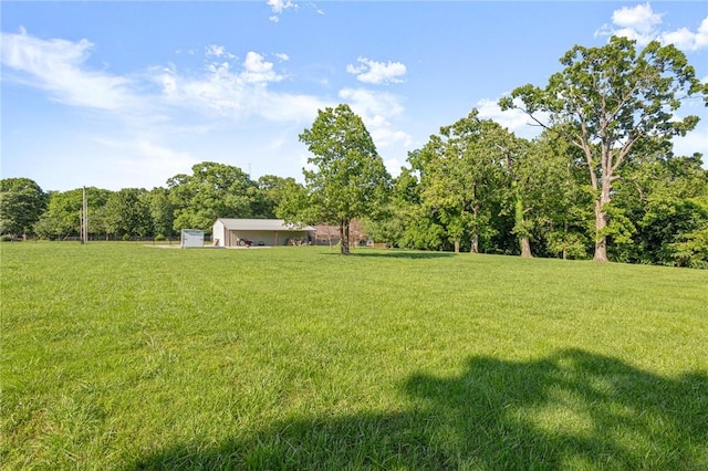 3307 NW 3rd St, Bentonville, AR 72712 - view of grassy yard featuring a view of trees