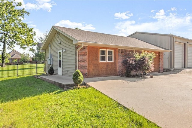 3307 NW 3rd St, Bentonville, AR 72712 - view of home's exterior featuring brick siding and driveway