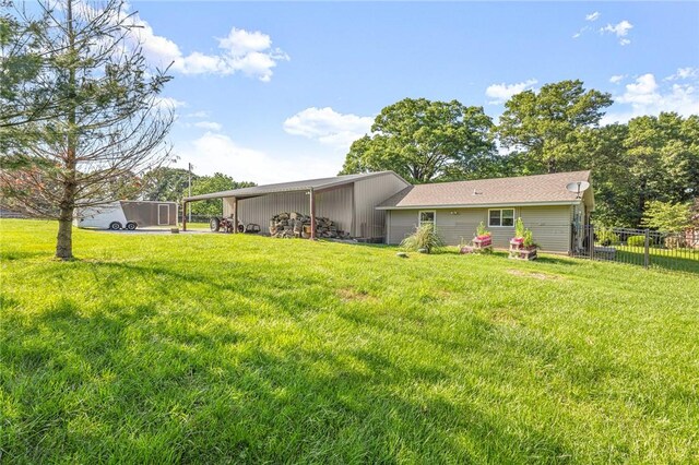 3307 NW 3rd St, Bentonville, AR 72712 - rear view of house featuring a pole building