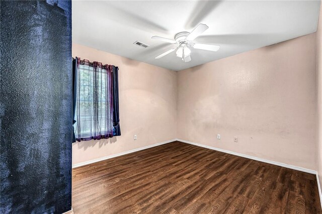 64 Cheryl Cir, Bentonville, AR 72712 - spare room with wood finished floors, a ceiling fan, and baseboards