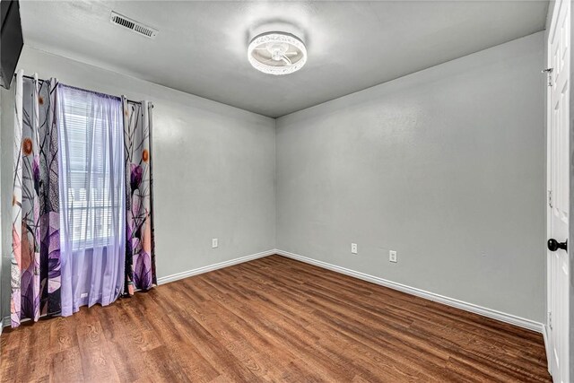 64 Cheryl Cir, Bentonville, AR 72712 - empty room featuring wood finished floors and baseboards