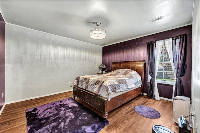 64 Cheryl Cir, Bentonville, AR 72712 - bedroom with wood finished floors, crown molding, and baseboards