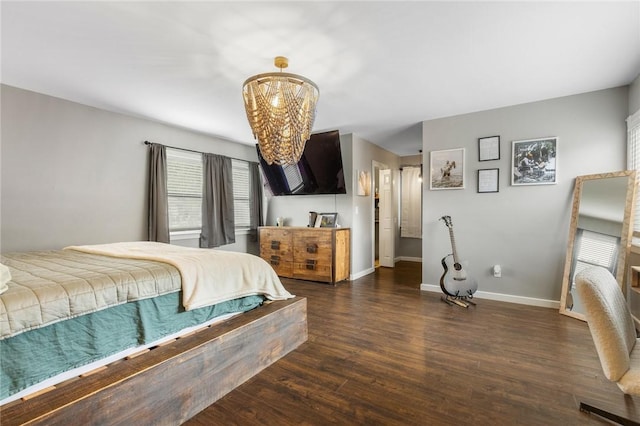 4220 S 7th Hwy, Harrison, AR 72601 - bedroom featuring a chandelier, wood finished floors, and baseboards