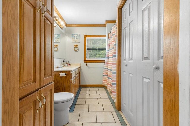 4220 S 7th Hwy, Harrison, AR 72601 - full bathroom with vanity, baseboards, ornamental molding, toilet, and tile patterned floors