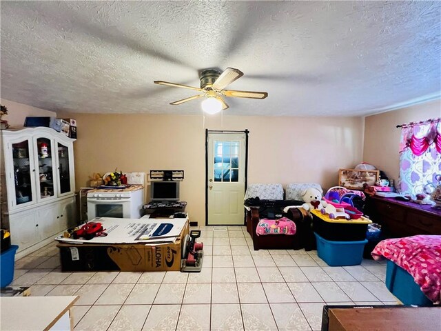 720 Circle Dr, Berryville, AR 72616 - living room with a ceiling fan, light tile patterned floors, and a textured ceiling