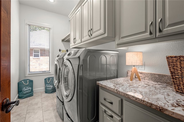 42 Devizis Dr, Bella Vista, AR 72714 - laundry area with cabinet space, separate washer and dryer, and baseboards
