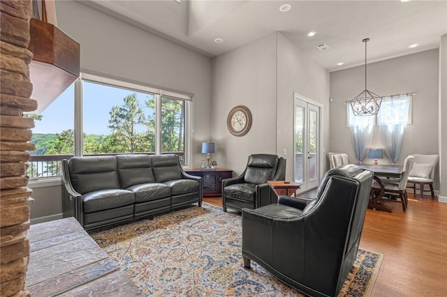 42 Devizis Dr, Bella Vista, AR 72714 - living room with a chandelier, wood finished floors, recessed lighting, and baseboards