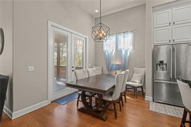 42 Devizis Dr, Bella Vista, AR 72714 - dining space with healthy amount of natural light, a chandelier, wood finished floors, and recessed lighting