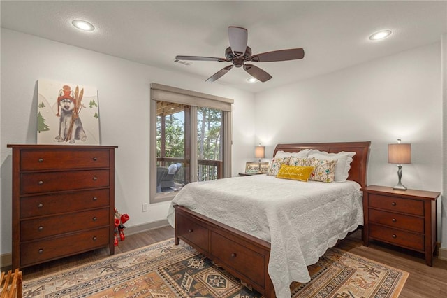 42 Devizis Dr, Bella Vista, AR 72714 - bedroom with access to exterior, wood finished floors, baseboards, ceiling fan, and recessed lighting