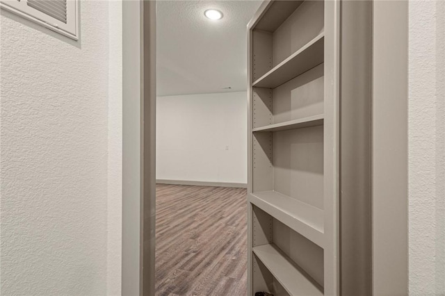 42 Devizis Dr, Bella Vista, AR 72714 - walk in closet with wood finished floors