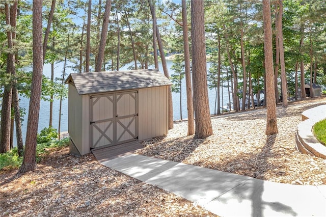 42 Devizis Dr, Bella Vista, AR 72714 - view of shed featuring a water view and view of scattered trees
