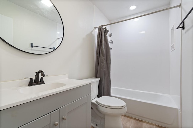 3021-3023 N Old Missouri Rd, Fayetteville, AR 72703 - full bathroom featuring vanity, shower / bath combo, toilet, wood finished floors, and recessed lighting