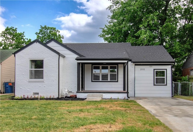 2532 E 4th St, Tulsa, OK 74104 - ranch-style home with a porch, brick siding, and a shingled roof