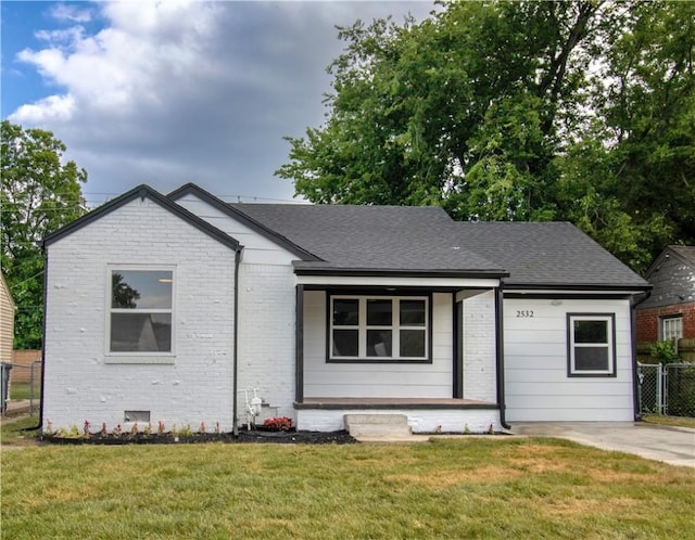2532 E 4th St, Tulsa, OK 74104 - ranch-style home featuring covered porch, brick siding, and a shingled roof