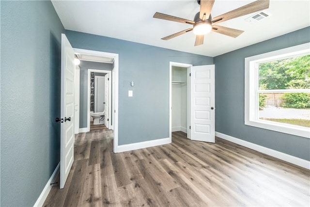 2532 E 4th St, Tulsa, OK 74104 - unfurnished bedroom with baseboards, wood finished floors, a closet, and ceiling fan