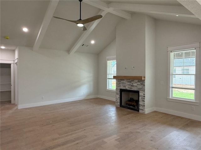 7695 Teton Trl, Springdale, AR 72762 - unfurnished living room with beam ceiling, a fireplace, baseboards, high vaulted ceiling, and ceiling fan
