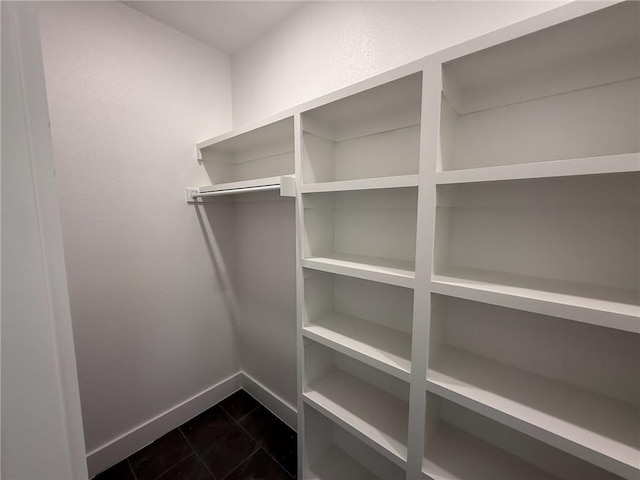 7695 Teton Trl, Springdale, AR 72762 - walk in closet featuring dark tile patterned floors