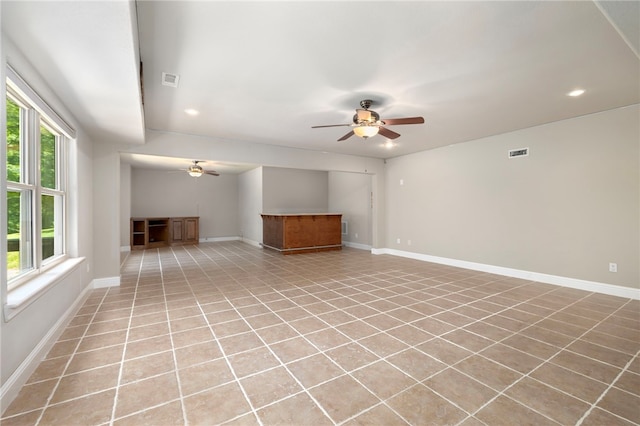 17 Webbly Ln, Bella Vista, AR 72714 - unfurnished living room with ceiling fan, recessed lighting, baseboards, and light tile patterned floors