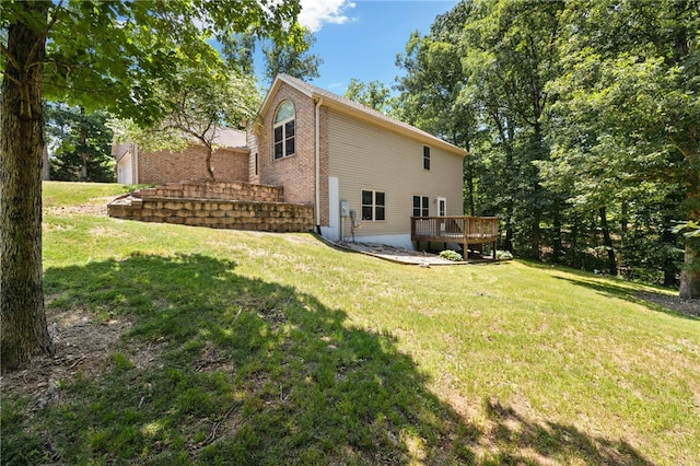 17 Webbly Ln, Bella Vista, AR 72714 - view of property exterior with a wooden deck, a lawn, and brick siding