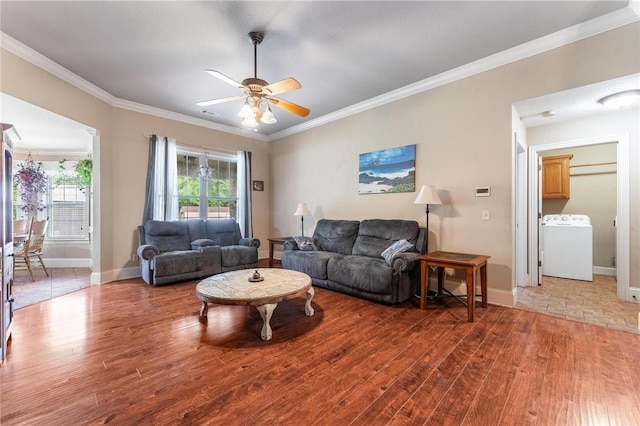 4931 Dogwood, Springdale, AR 72762 - living room with washer / dryer, light wood-style flooring, crown molding, ceiling fan, and baseboards