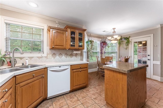 4931 Dogwood, Springdale, AR 72762 - kitchen featuring white dishwasher, a sink, a center island, crown molding, and tasteful backsplash
