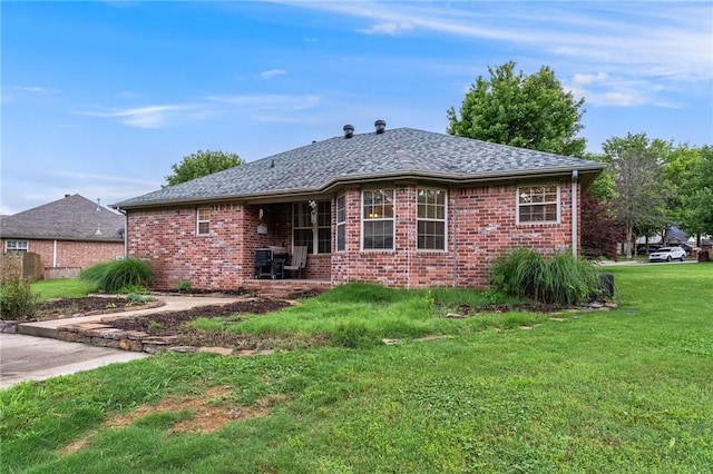 4931 Dogwood, Springdale, AR 72762 - rear view of house with a yard, brick siding, and a shingled roof