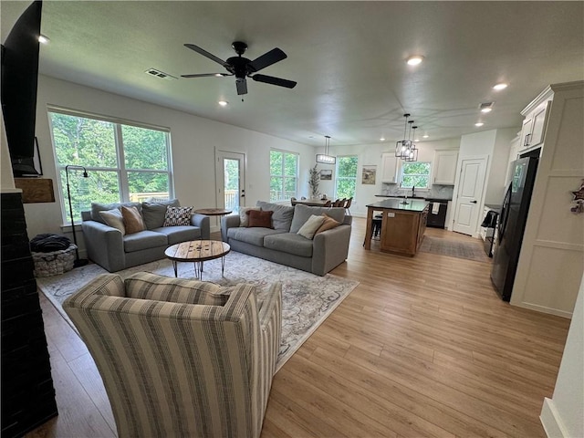 1 Llanon Cir, Bella Vista, AR 72714 - living area featuring ceiling fan, recessed lighting, and light wood-style floors
