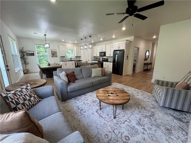 1 Llanon Cir, Bella Vista, AR 72714 - living area featuring recessed lighting, baseboards, light wood-style floors, and ceiling fan