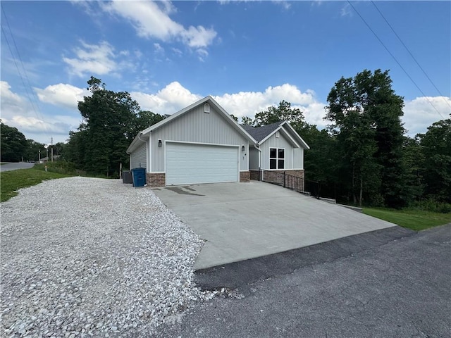 1 Llanon Cir, Bella Vista, AR 72714 - view of property exterior with driveway, a garage, and brick siding