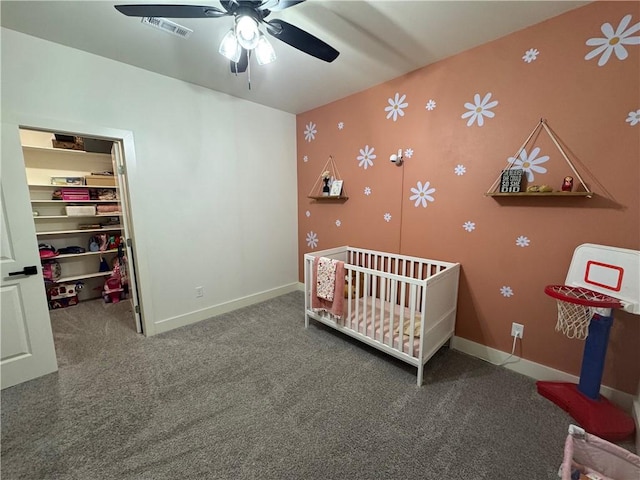 1 Llanon Cir, Bella Vista, AR 72714 - carpeted bedroom featuring a walk in closet, baseboards, a nursery area, and a closet