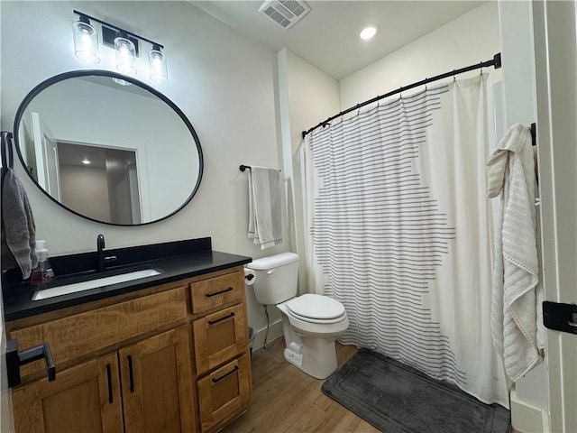 1 Llanon Cir, Bella Vista, AR 72714 - full bath with vanity, toilet, wood finished floors, curtained shower, and recessed lighting