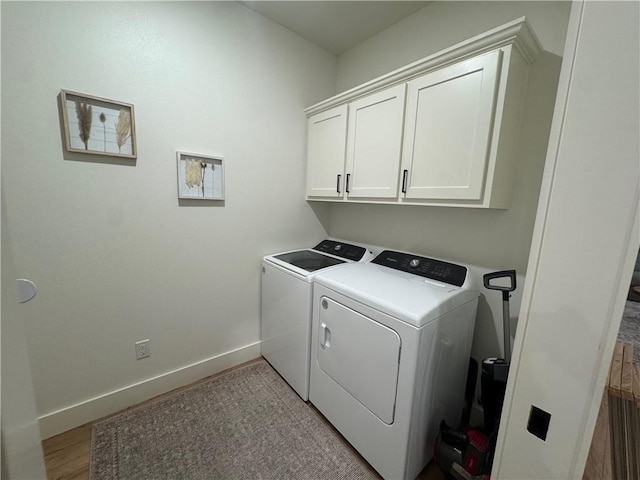 1 Llanon Cir, Bella Vista, AR 72714 - laundry area featuring washing machine and clothes dryer, cabinet space, and baseboards