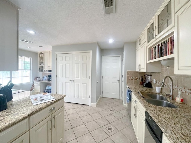 405-407 Rena Rd, Van Buren, AR 72956 - kitchen featuring a sink, open shelves, dishwasher, backsplash, and light tile patterned floors