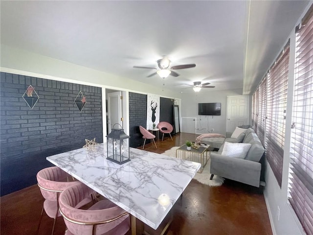 405-407 Rena Rd, Van Buren, AR 72956 - dining room with brick wall and a ceiling fan