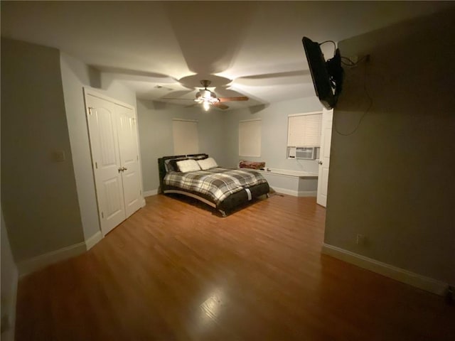 405-407 Rena Rd, Van Buren, AR 72956 - bedroom with wood finished floors, baseboards, cooling unit, and ceiling fan