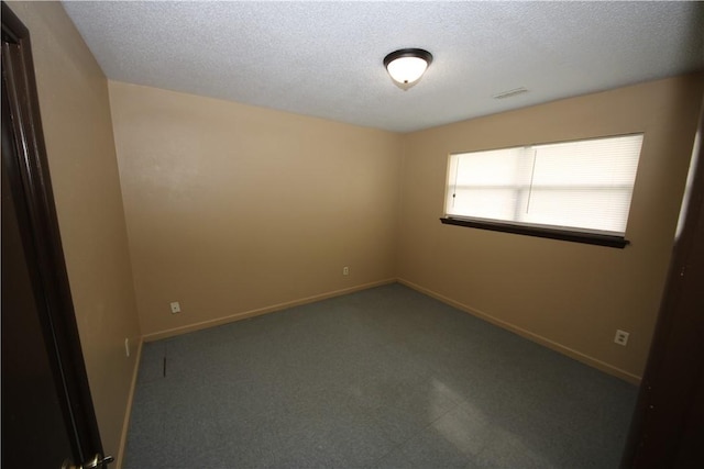 1404 W Margaret Pl, Rogers, AR 72756 - spare room with a textured ceiling and baseboards