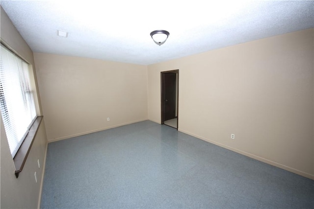 1404 W Margaret Pl, Rogers, AR 72756 - spare room featuring baseboards