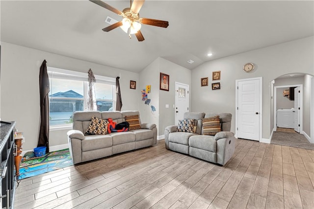 200 Post Oak Ave, Gentry, AR 72734 - living area featuring arched walkways, washer / dryer, light wood-style floors, ceiling fan, and baseboards